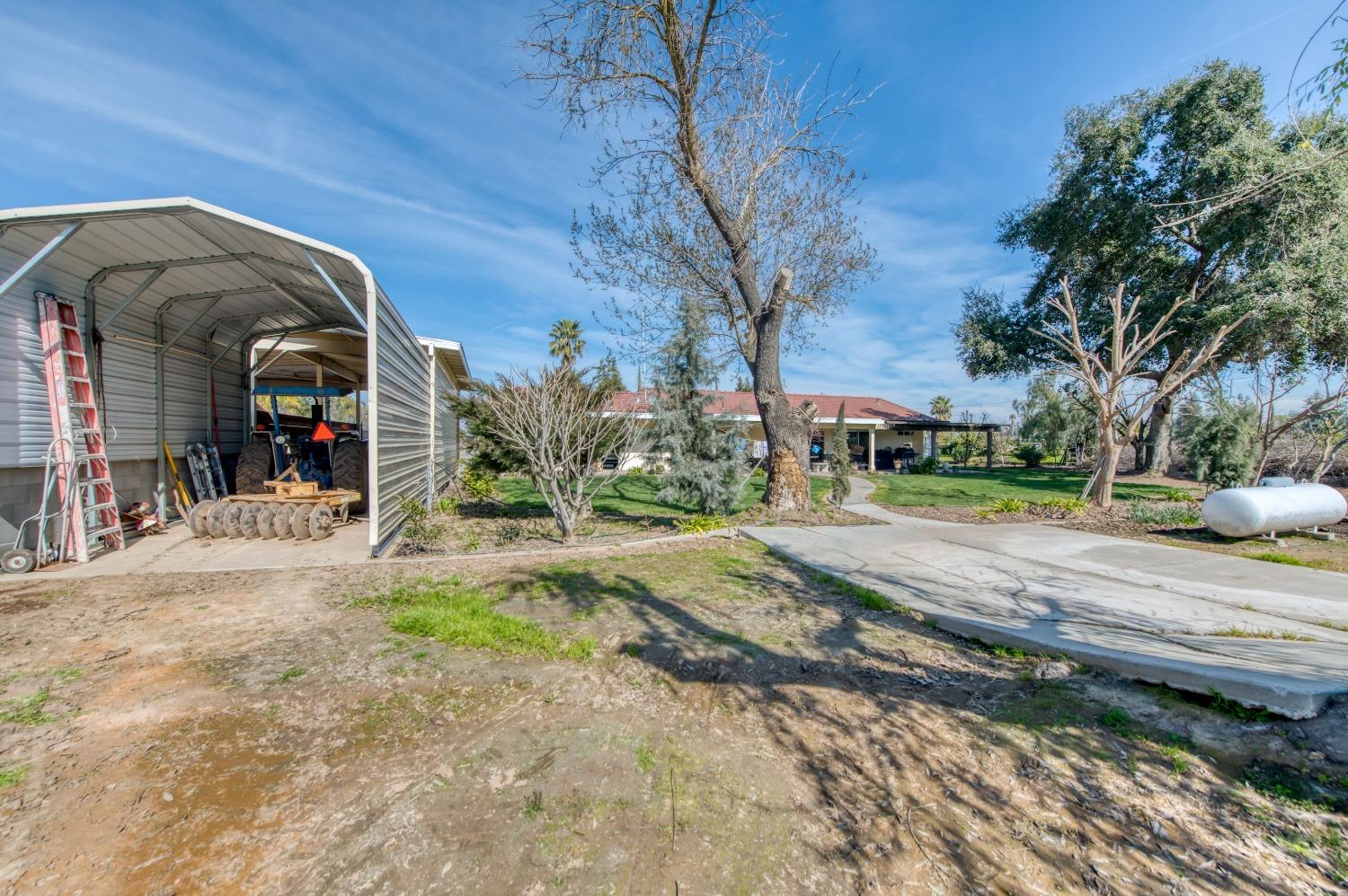 25540 Lynn Place, Unit B Madera, CA 93638 - Photo 29 of 37 a view of a street with houses