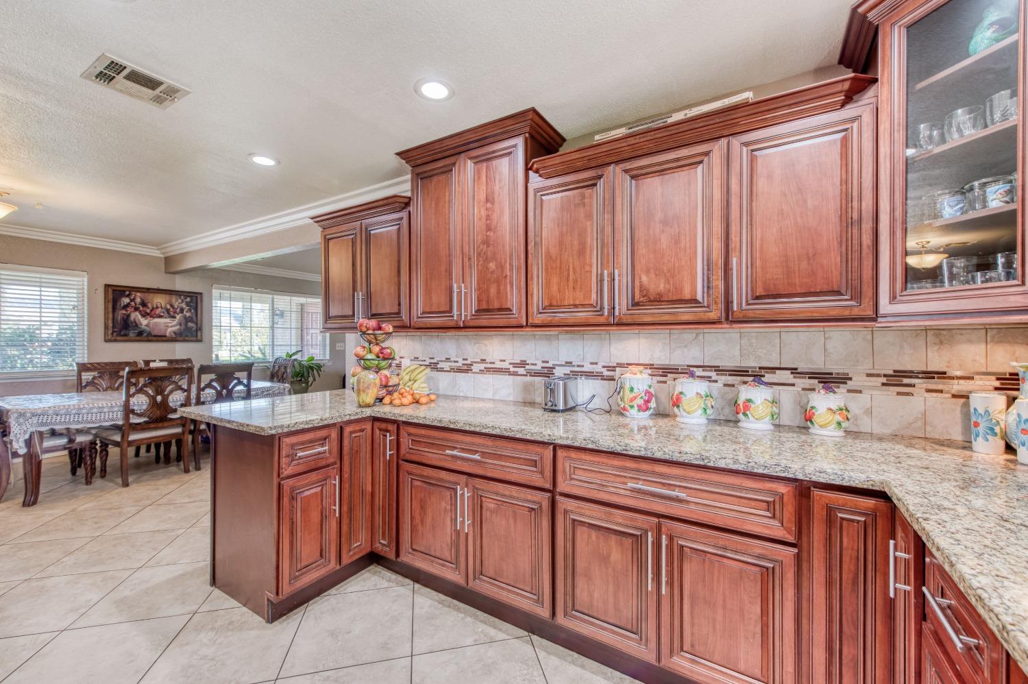 25540 Lynn Place, Unit B Madera, CA 93638 - Photo 7 of 37 a kitchen with a sink and cabinets