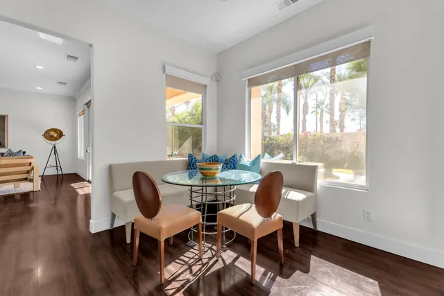 a bedroom with a bed couch and window