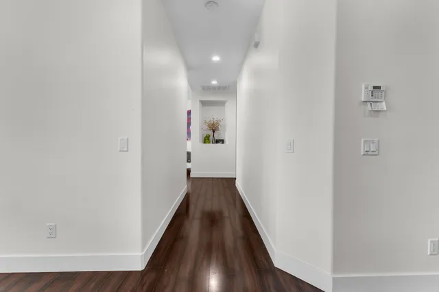 a bedroom with a bed and flat screen tv