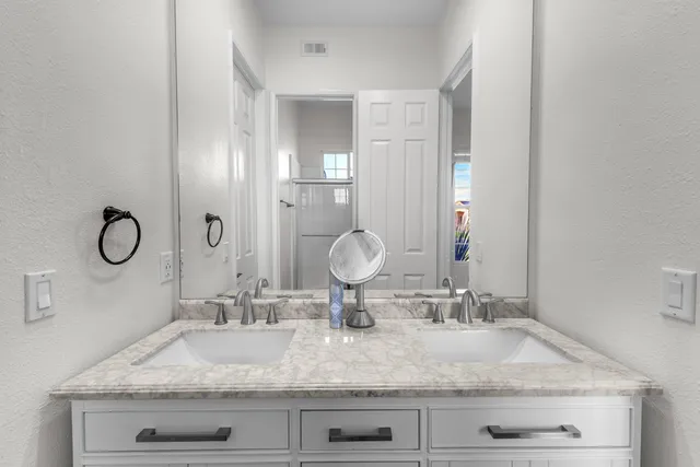 a view of a house with backyard porch and sitting area