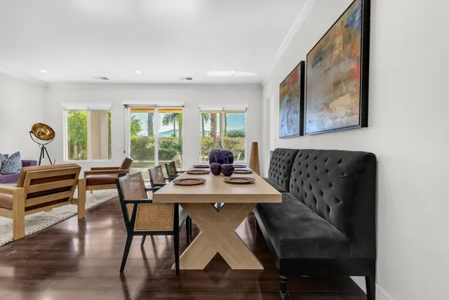 a view of a dining room with furniture window and wooden floor
