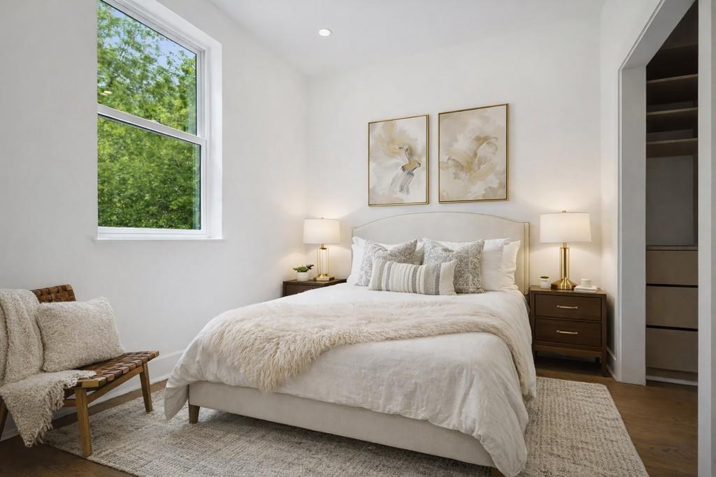 1570 Flat Shoals Road Southeast, Unit 7 Atlanta, GA 30316 - Photo 21 of 35 a bedroom with a bed and a painting on the wall