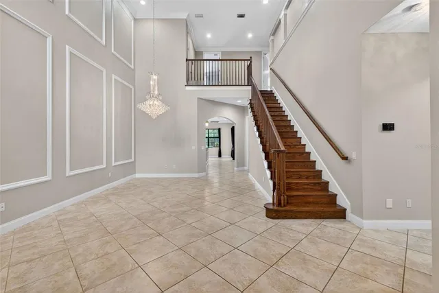 a kitchen with stainless steel appliances granite countertop a stove top oven a sink refrigerator and cabinets