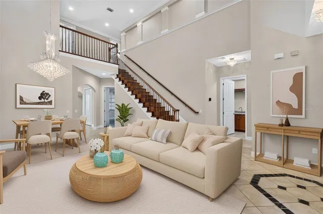 a kitchen with granite countertop a refrigerator and a stove top oven