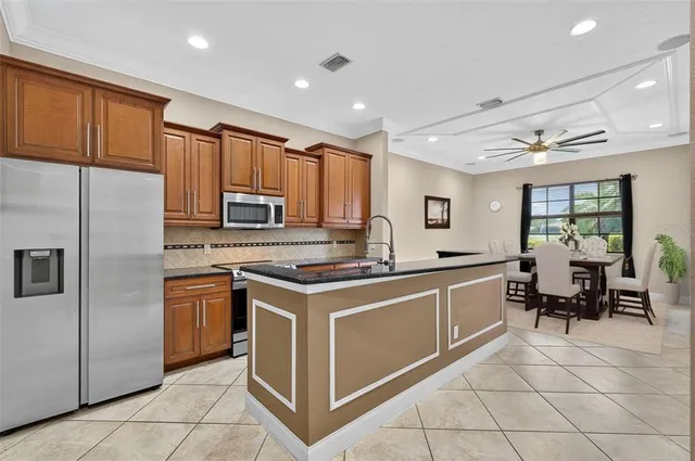 a white bath tub sitting next to a toilet