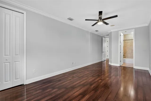 an aerial view of a house with a yard and lake view