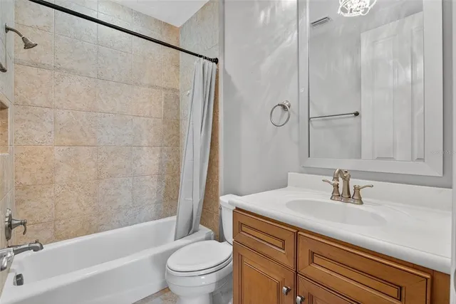 an aerial view of a house with outdoor space