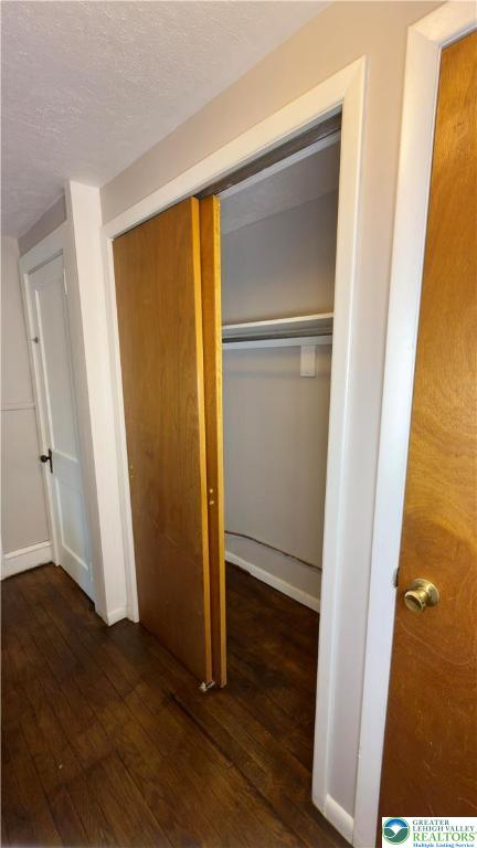 1236 Main Street, Unit 2 Hellertown, PA 18055 - Photo 24 of 29 an empty room with wooden floor and closet