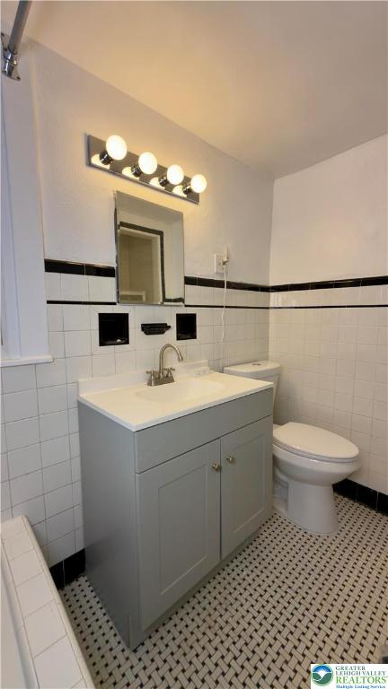 1236 Main Street, Unit 2 Hellertown, PA 18055 - Photo 26 of 29 a bathroom with a sink toilet and mirror