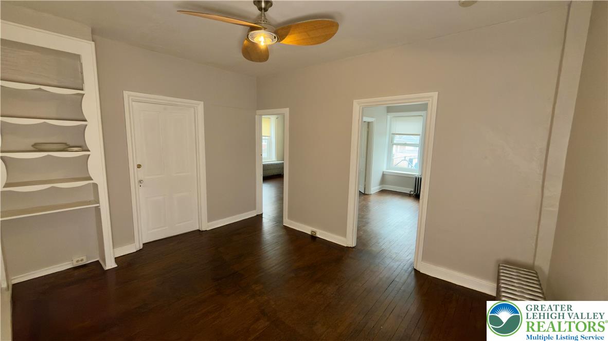 1236 Main Street, Unit 2 Hellertown, PA 18055 - Photo 6 of 29 an empty room with wooden floor and windows