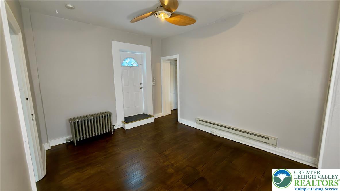 1236 Main Street, Unit 2 Hellertown, PA 18055 - Photo 9 of 29 an empty room with wooden floor and windows