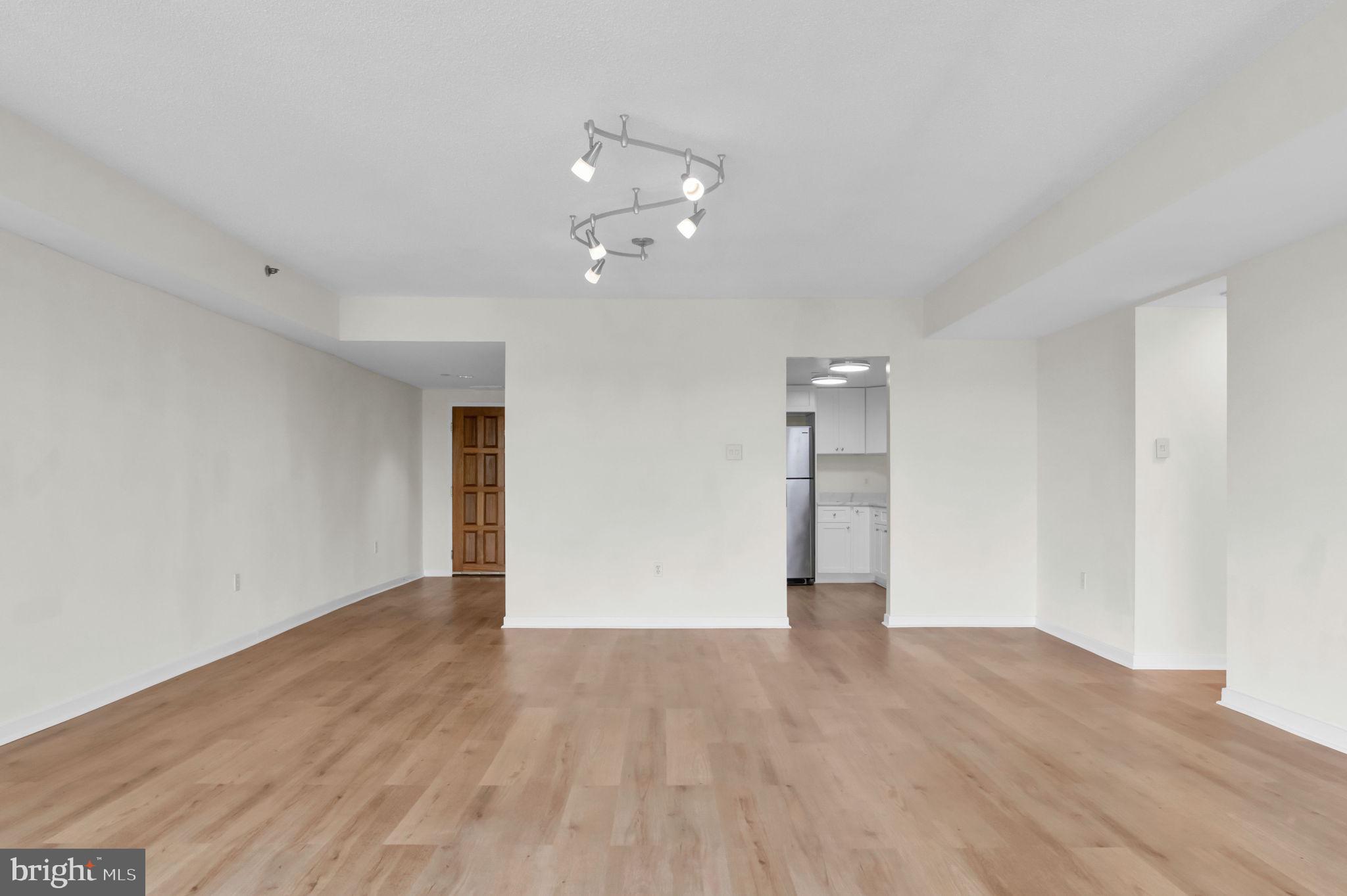 1530 Key Boulevard, Unit 715 Arlington, VA 22209 - Photo 15 of 41 wooden floor in an empty room with a window