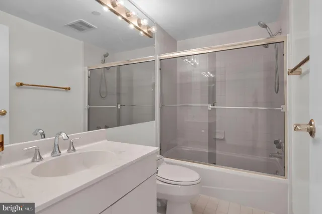 a bathroom with a shower and a toilet
