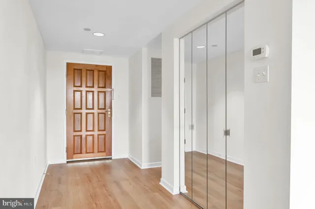 a view of entryway with wooden floor