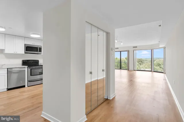 a view of a kitchen with a stove top oven