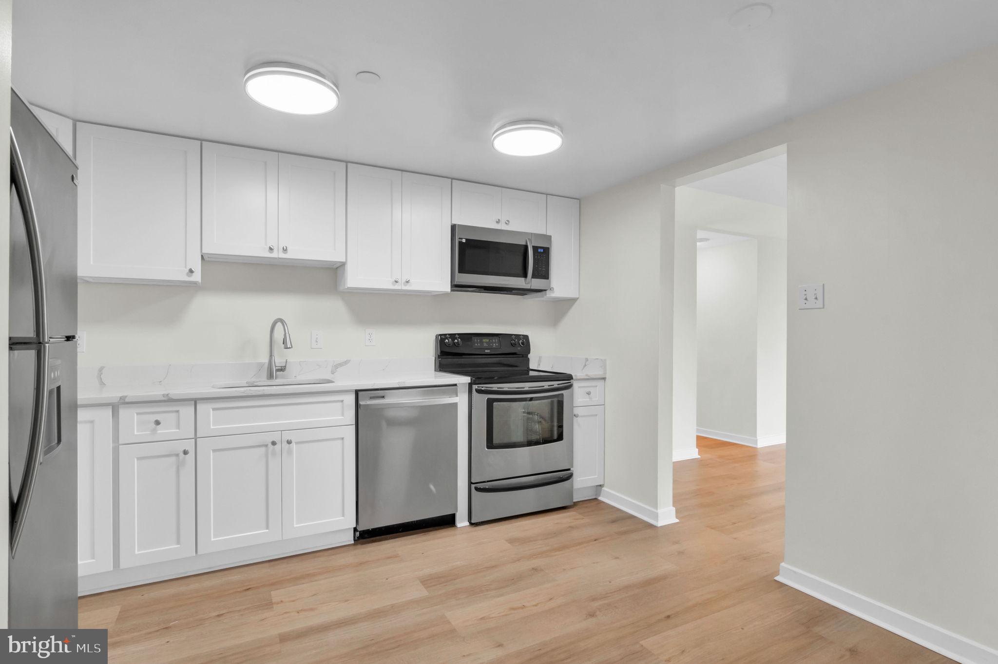1530 Key Boulevard, Unit 715 Arlington, VA 22209 - Photo 6 of 41 a kitchen with a stove and a sink