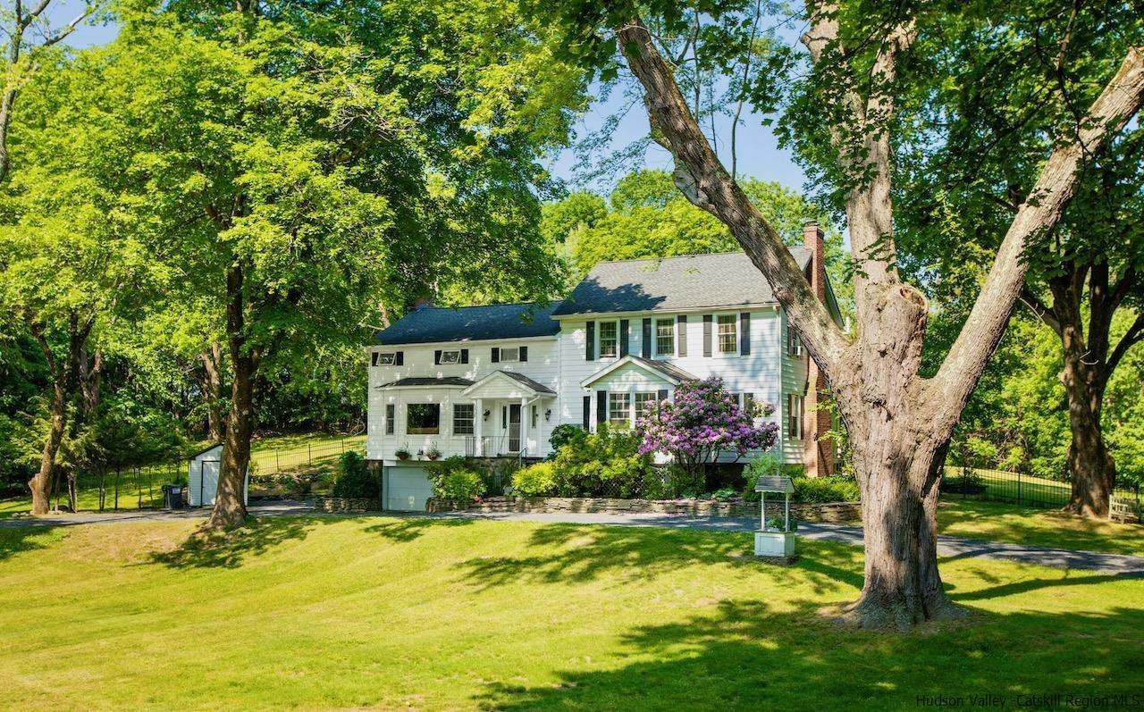 1182 Highway 208 Wallkill, NY 12589 - Photo 1 of 35 a front view of a house with a yard table and chairs