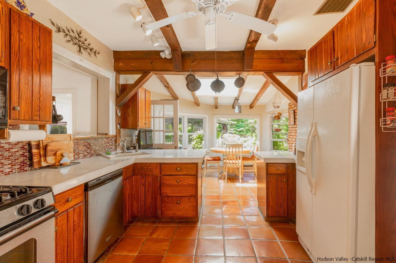 1182 Highway 208 Wallkill, NY 12589 - Photo 13 of 35 a kitchen with stainless steel appliances a sink a stove and a refrigerator