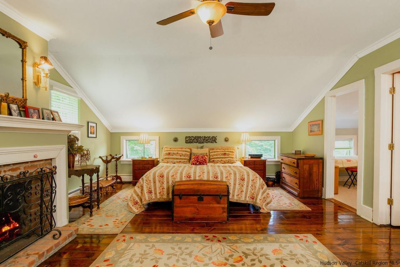 1182 Highway 208 Wallkill, NY 12589 - Photo 17 of 35 a living room with furniture and a fireplace