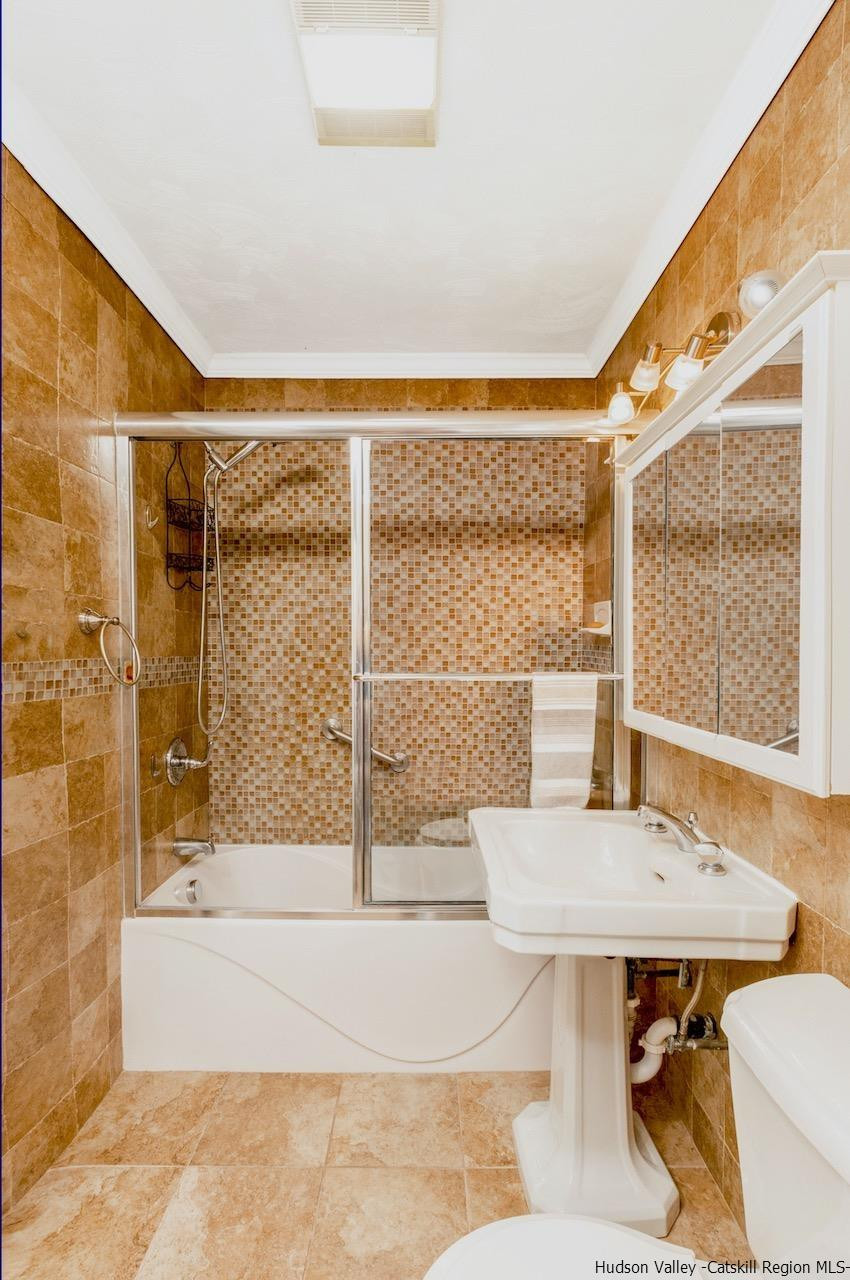 1182 Highway 208 Wallkill, NY 12589 - Photo 23 of 35 a bathroom with a bathtub and a sink