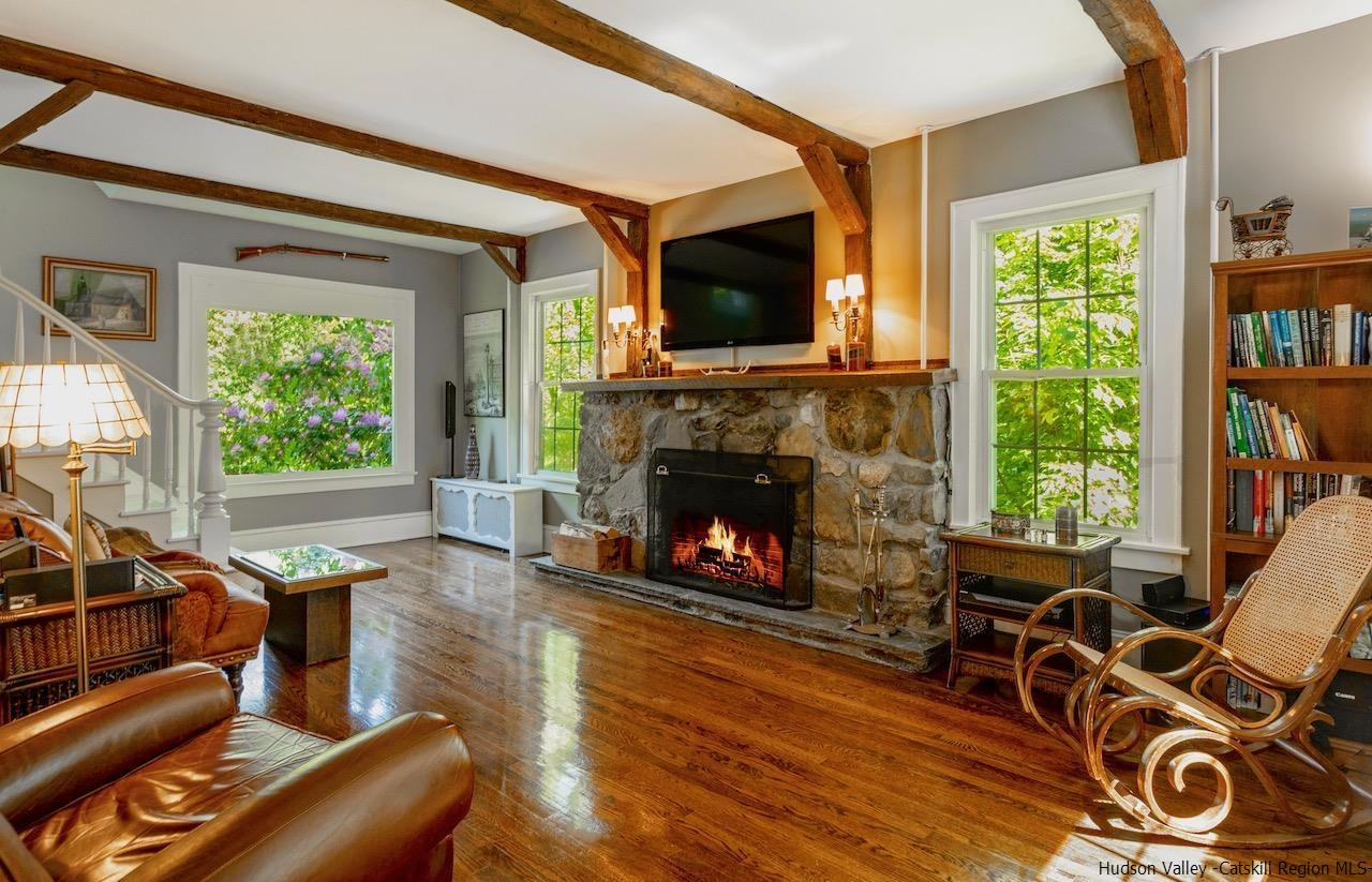 1182 Highway 208 Wallkill, NY 12589 - Photo 3 of 35 a living room with furniture a flat screen tv and a fireplace