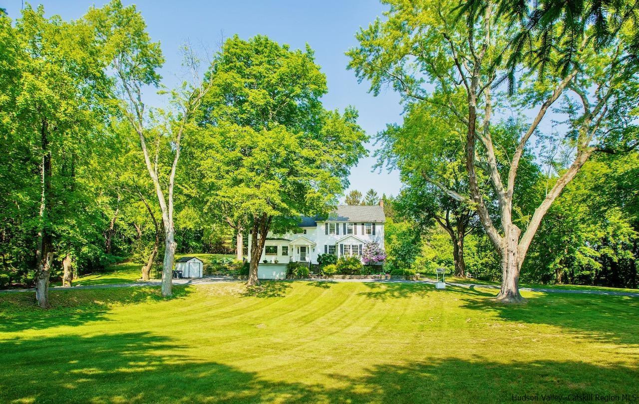 1182 Highway 208 Wallkill, NY 12589 - Photo 34 of 35 a view of a swimming pool with lawn chairs and large trees