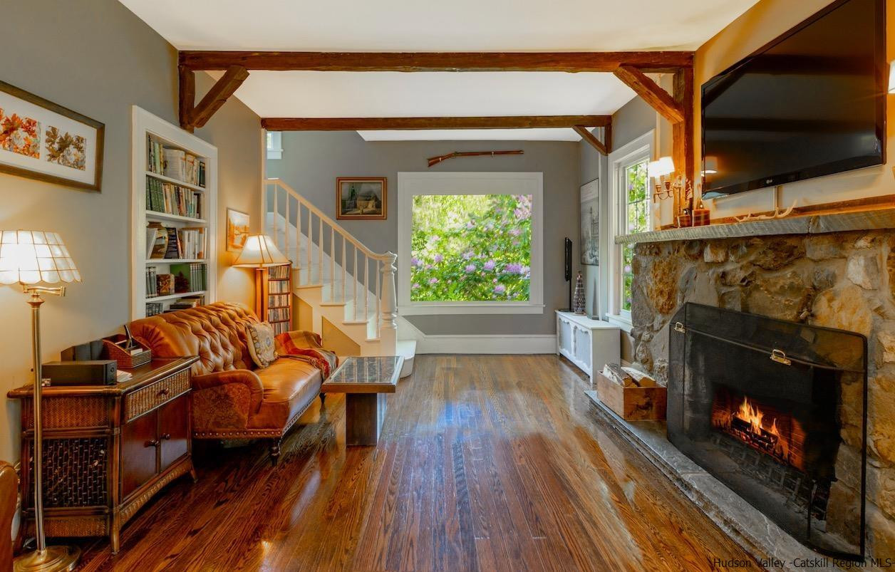 1182 Highway 208 Wallkill, NY 12589 - Photo 4 of 35 a living room with furniture a flat screen tv and a fireplace