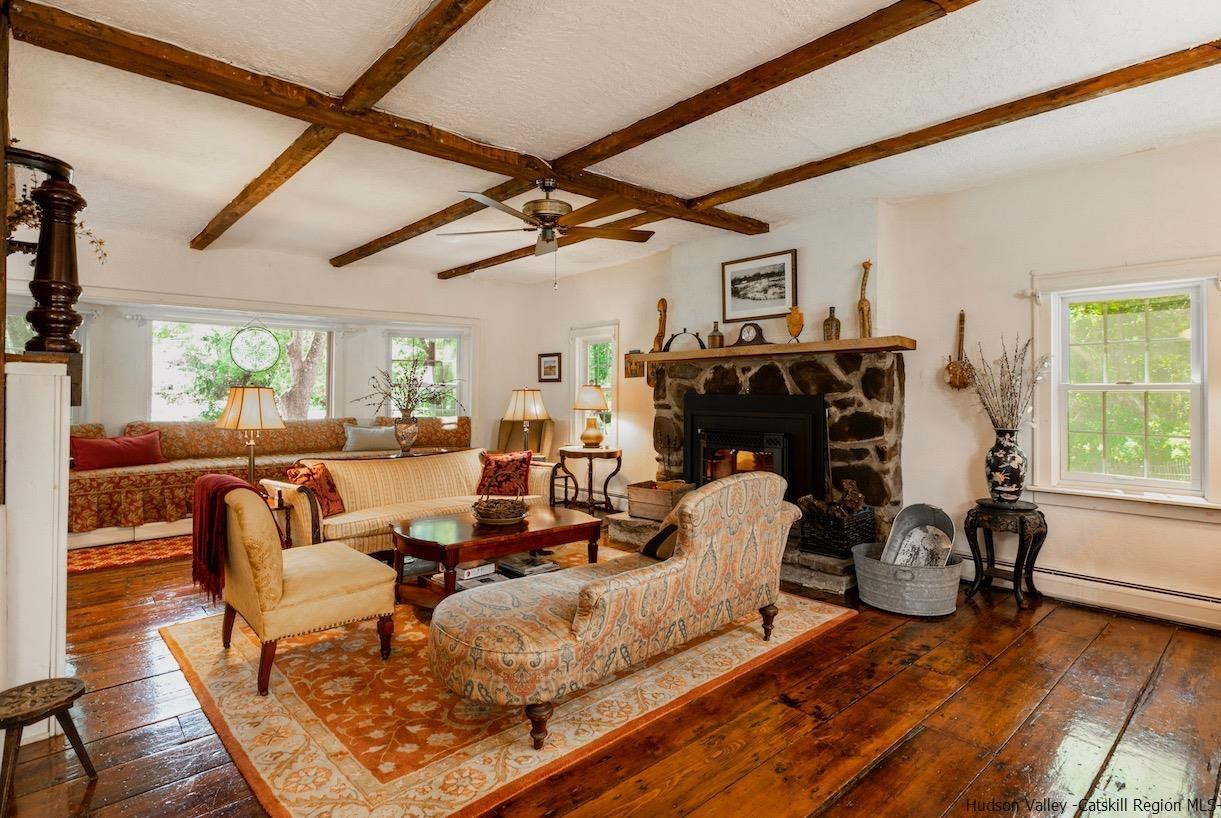 1182 Highway 208 Wallkill, NY 12589 - Photo 7 of 35 a living room with furniture and a fireplace