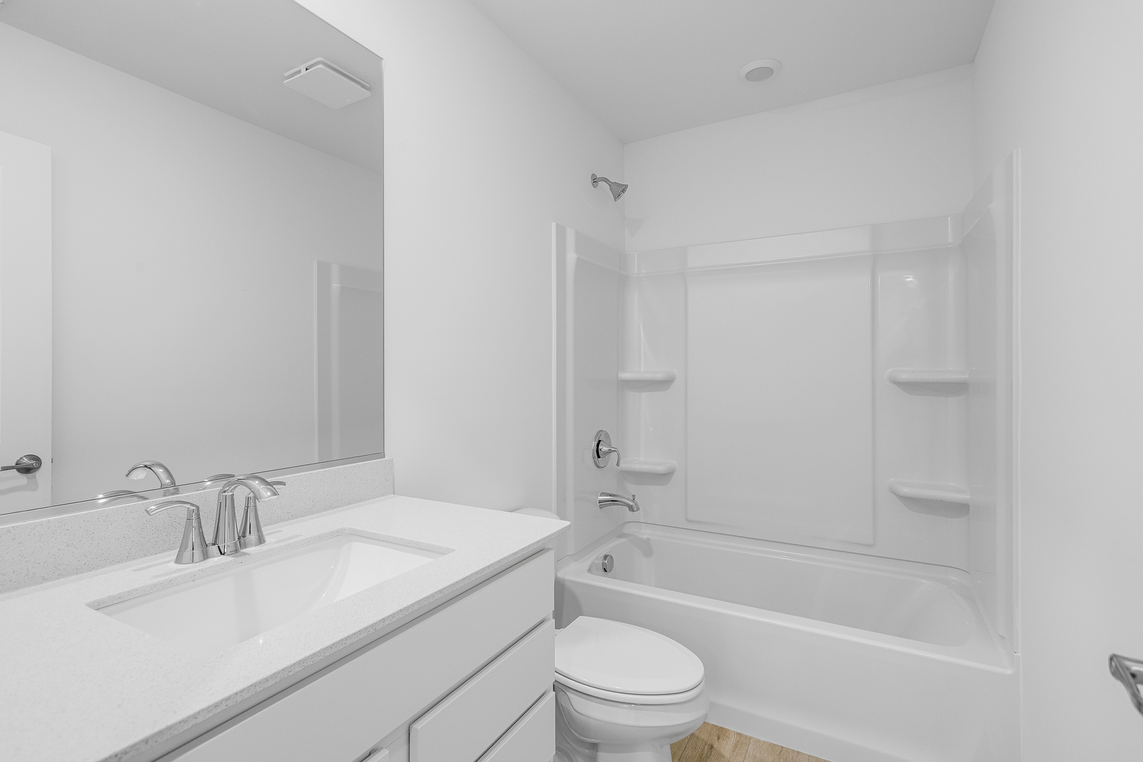 421 Red Oak Circle Volo, IL 60020 - Photo 9 of 12 a bathroom with a bathtub shower sink vanity mirror and toilet