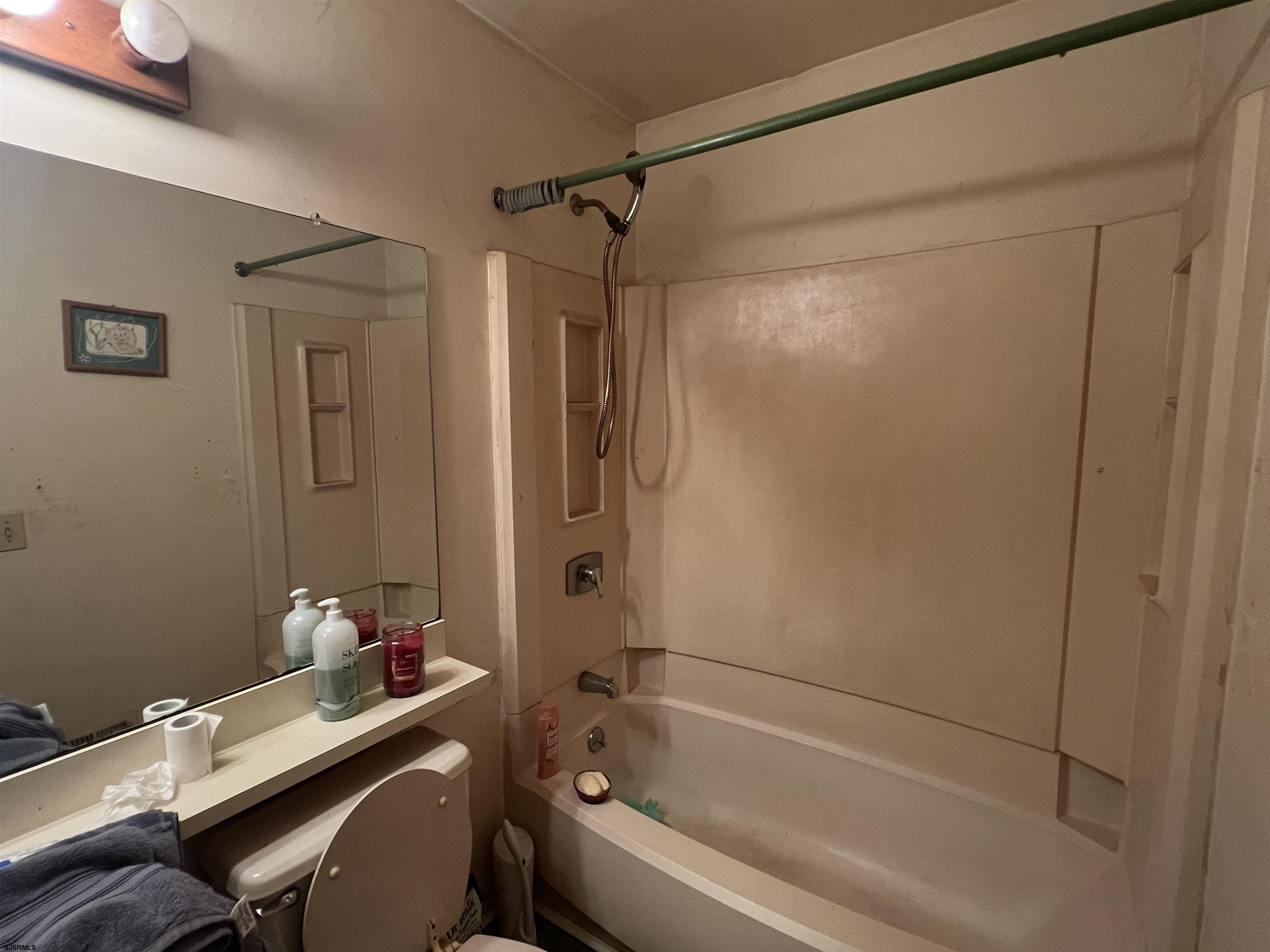 152 Club Place, Unit 152 Galloway Township, NJ 08205 - Photo 13 of 23 a bathroom with a bathtub and a shower