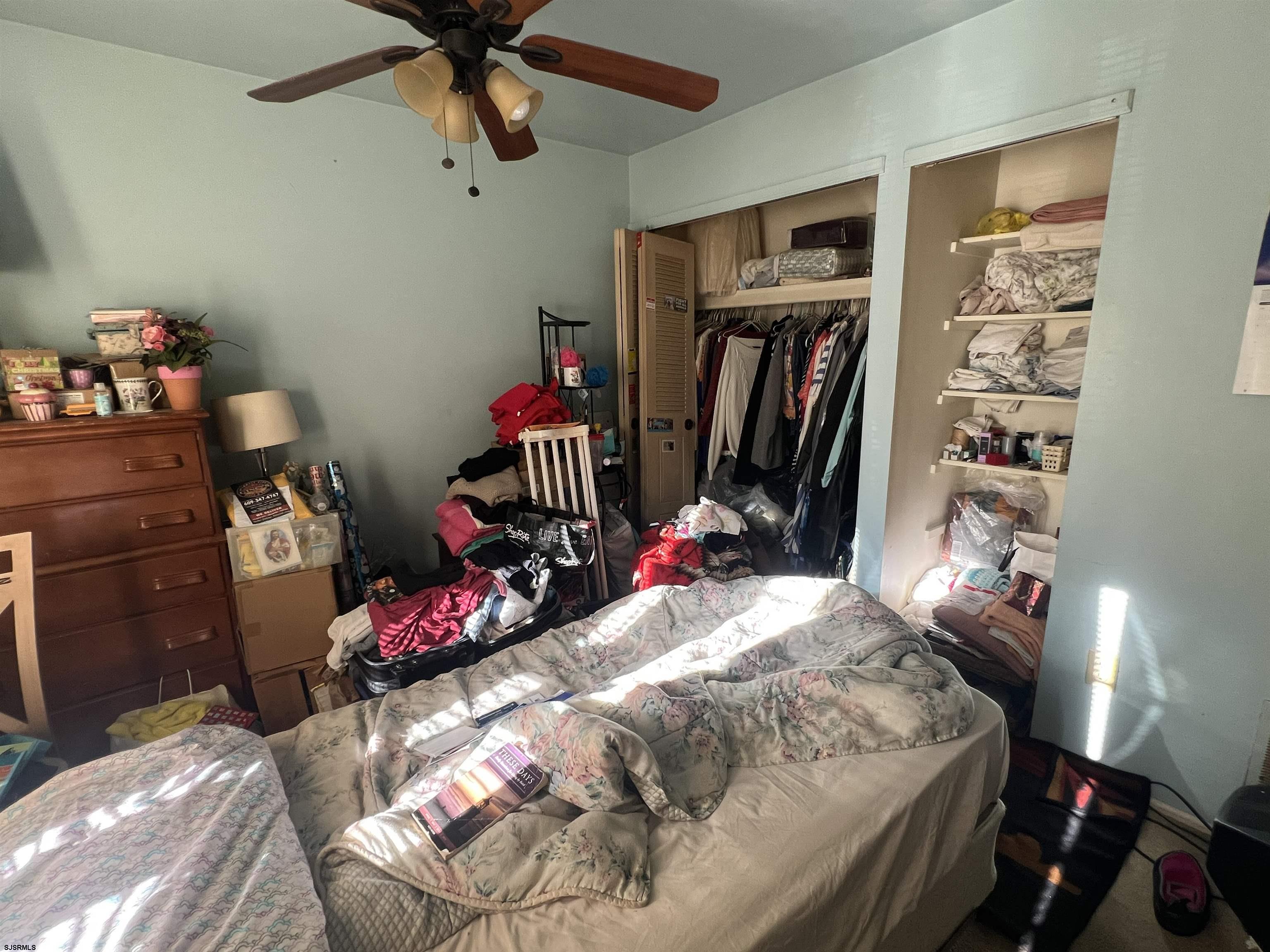 152 Club Place, Unit 152 Galloway Township, NJ 08205 - Photo 15 of 23 a bedroom with a bed closet and dresser