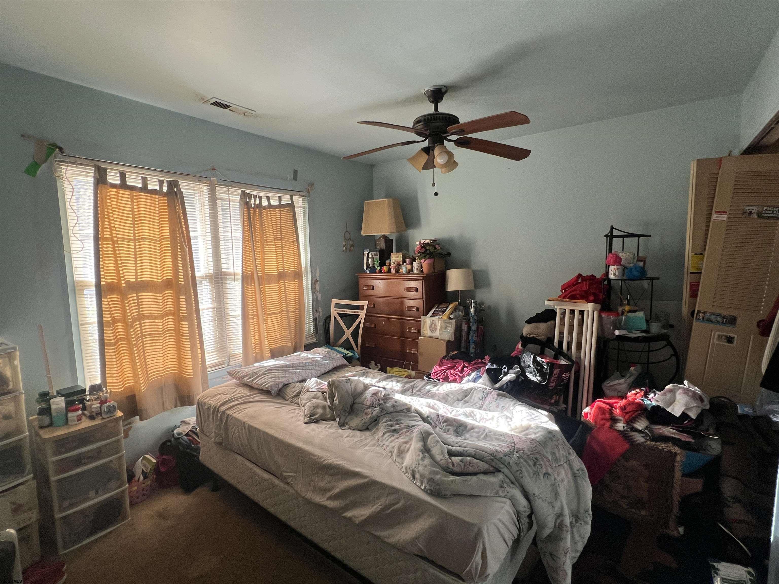 152 Club Place, Unit 152 Galloway Township, NJ 08205 - Photo 16 of 23 a bedroom with bed and a window