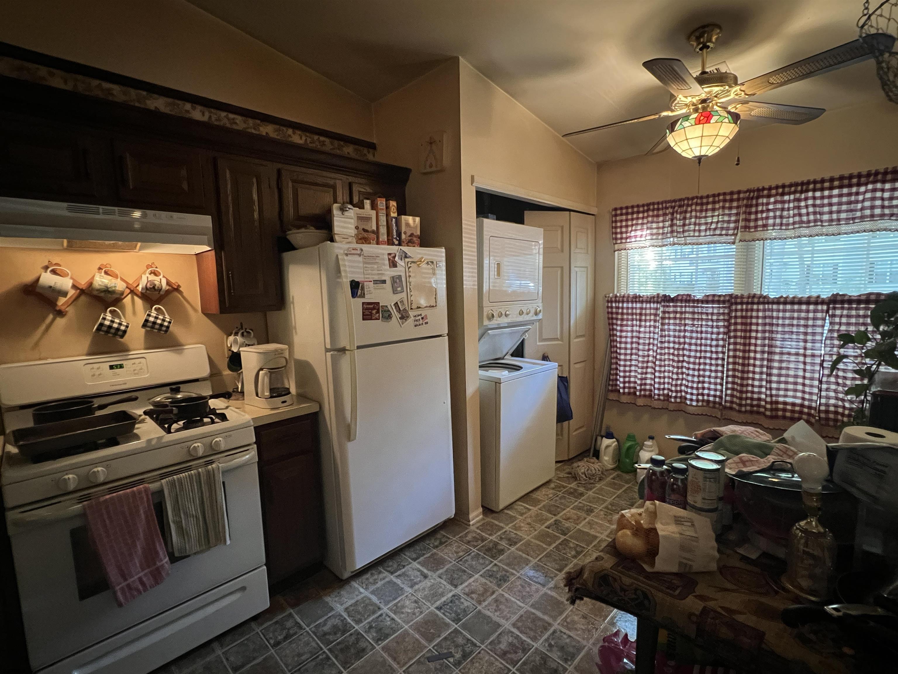 152 Club Place, Unit 152 Galloway Township, NJ 08205 - Photo 19 of 23 a kitchen with refrigerator a stove a washer and dryer