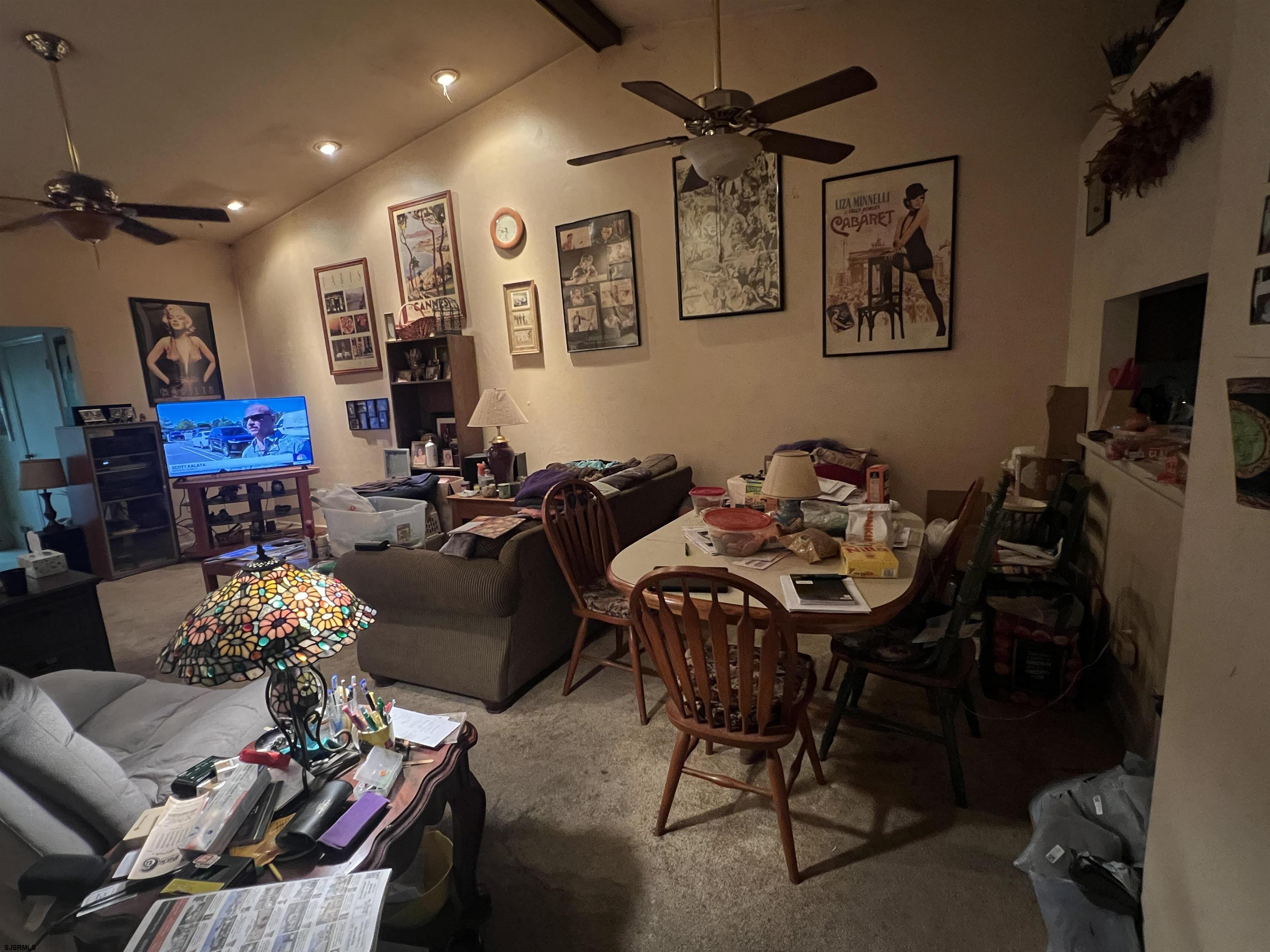 152 Club Place, Unit 152 Galloway Township, NJ 08205 - Photo 3 of 23 a living room with furniture a chandelier and a flat screen tv