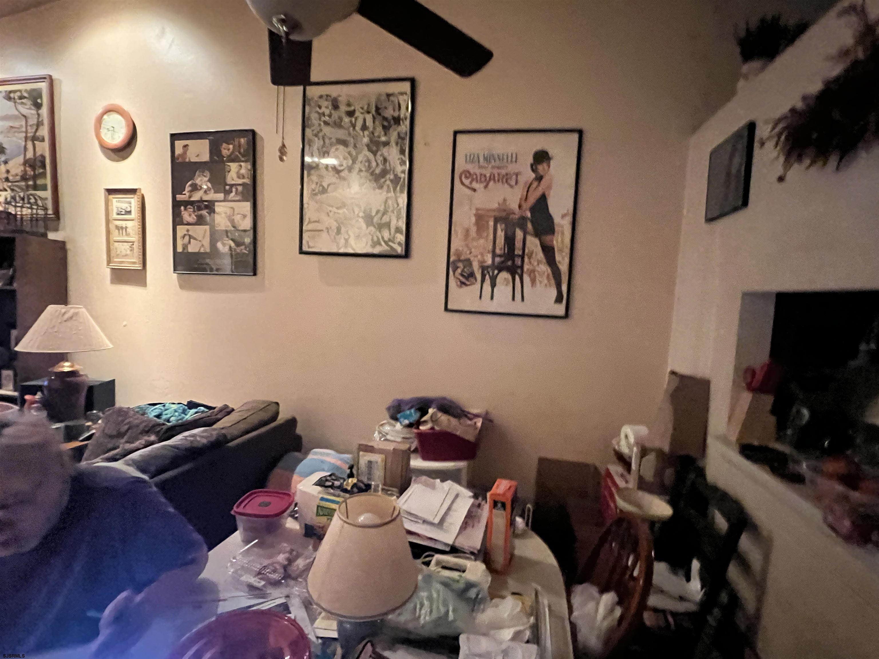 152 Club Place, Unit 152 Galloway Township, NJ 08205 - Photo 8 of 23 a room with furniture and a flat screen tv