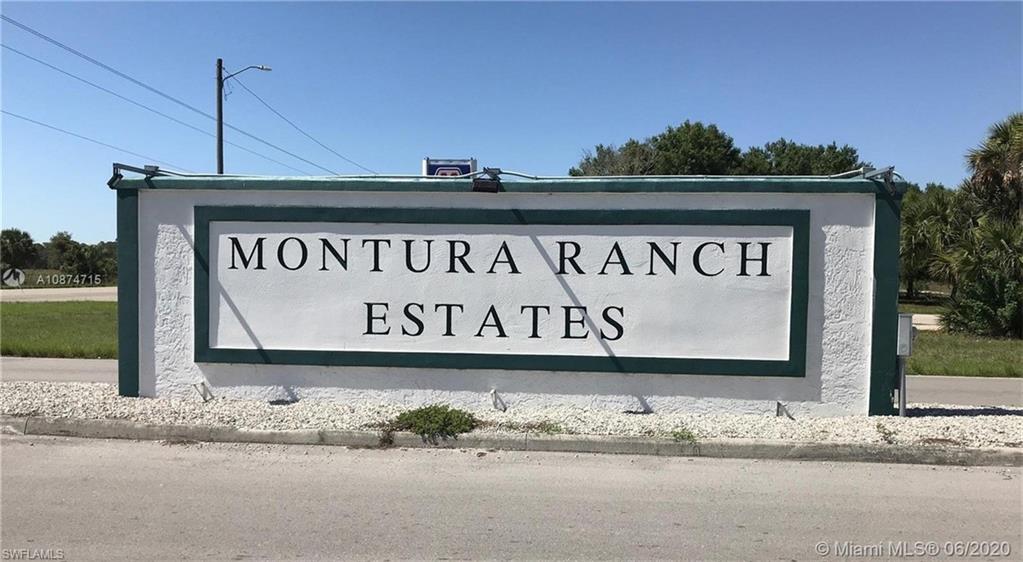 612 Hunting Clb Avenue Montura Ranches, FL 33440 - Photo 40 of 49 a sign that is on the side of the road