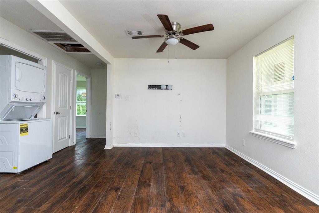 805 East Belt Line Road DeSoto, TX 75115 - Photo 3 of 15 wooden floor in an empty room with a window