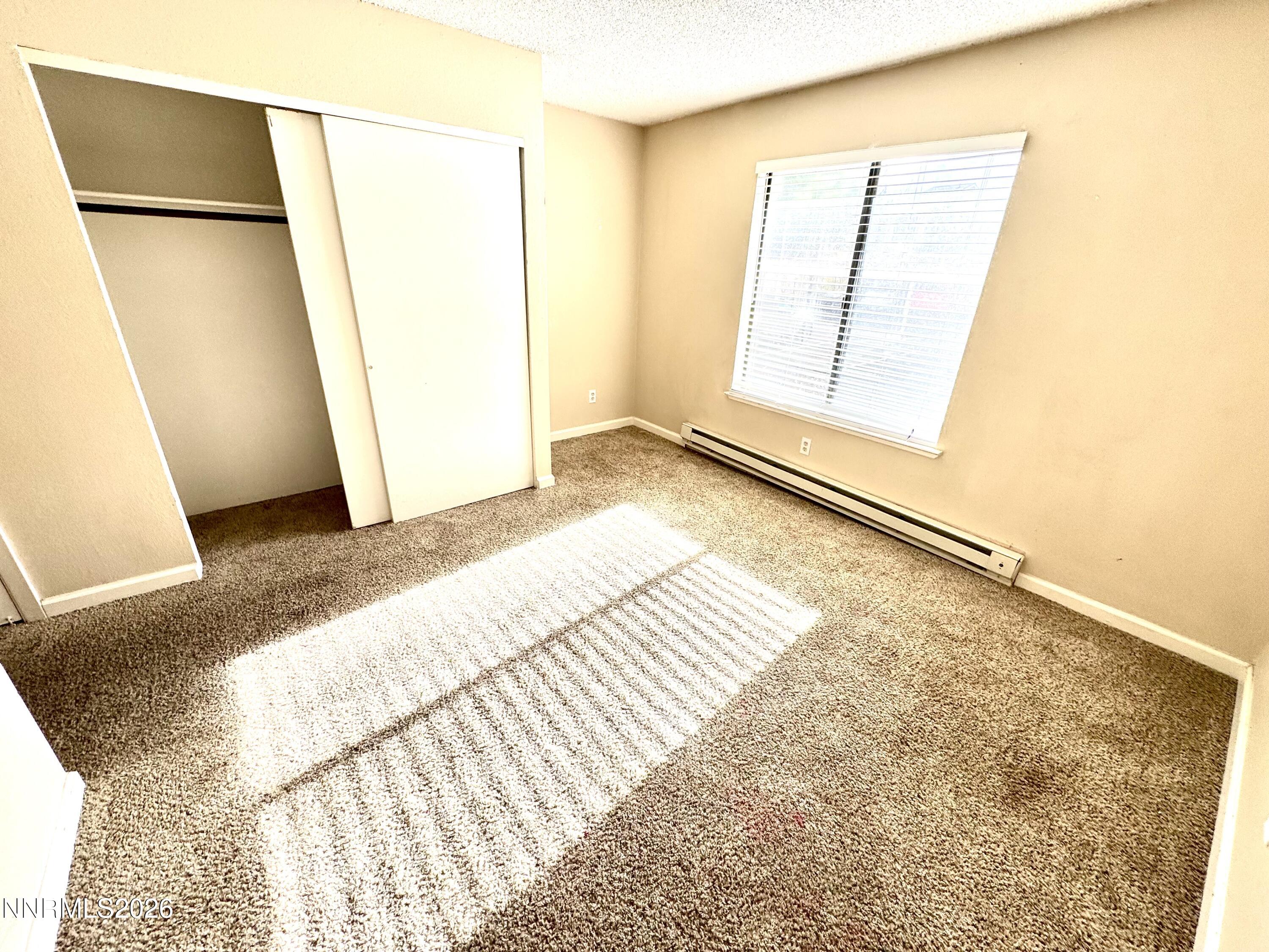 3880 East Leonesio Drive, Unit C2 Reno, NV 89512 - Photo 8 of 10 a view of a room with a refrigerator