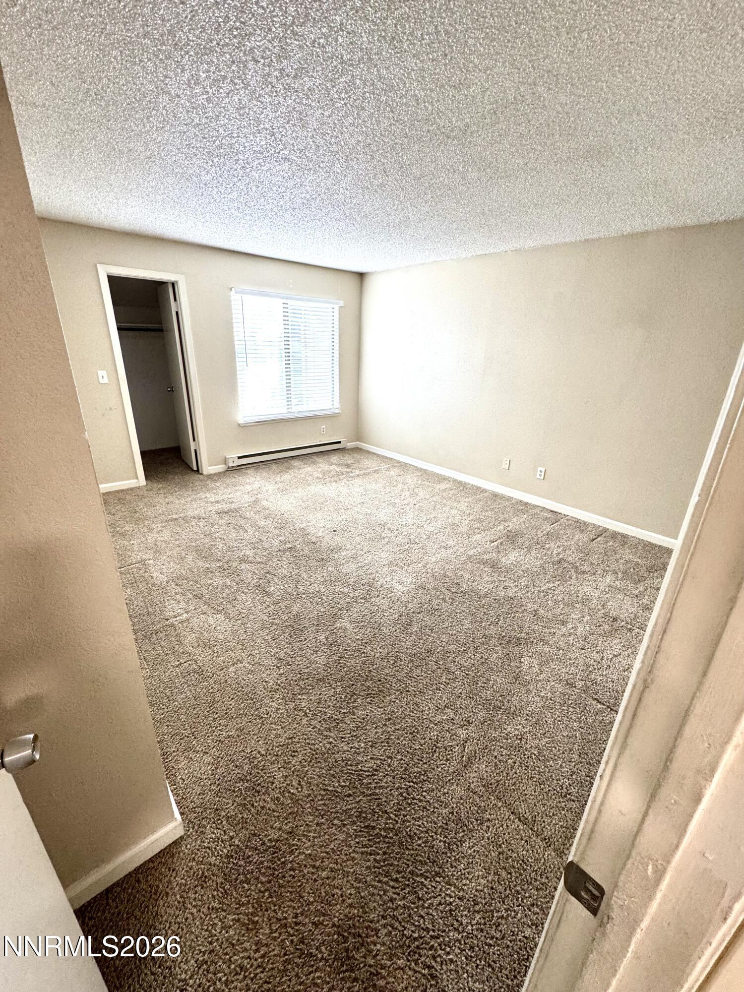 3880 East Leonesio Drive, Unit C2 Reno, NV 89512 - Photo 10 of 10 a view of an empty room and a window
