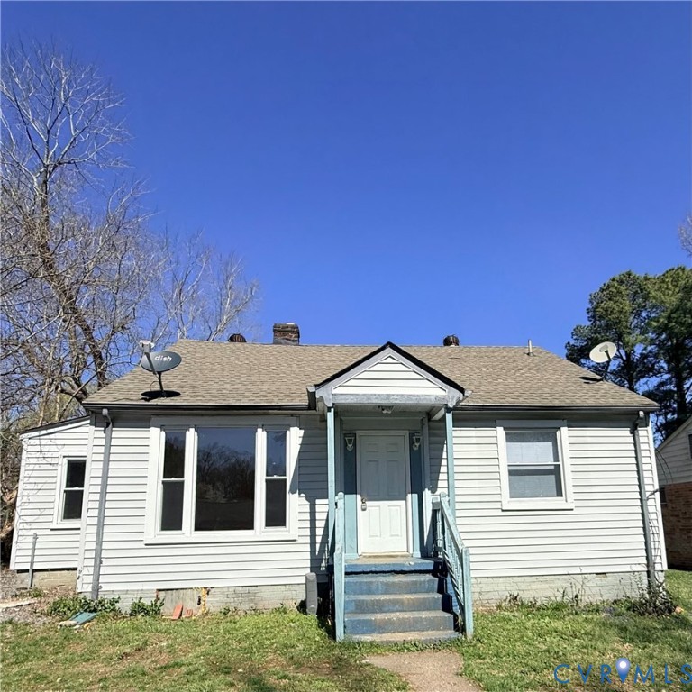 2928 Springview Drive Richmond, VA 23234 - Photo 1 of 15 a front view of a house with a garage