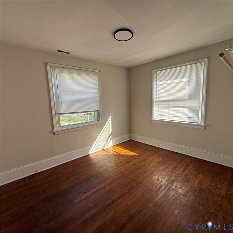 2928 Springview Drive Richmond, VA 23234 - Photo 11 of 15 a view of an empty room with wooden floor and a window