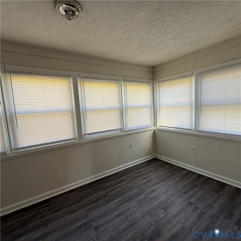 2928 Springview Drive Richmond, VA 23234 - Photo 13 of 15 an empty room with wooden floor and windows