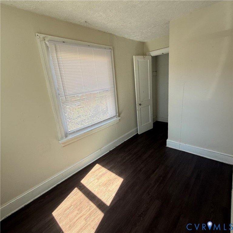 2928 Springview Drive Richmond, VA 23234 - Photo 6 of 15 a view of an empty room with wooden floor and a window