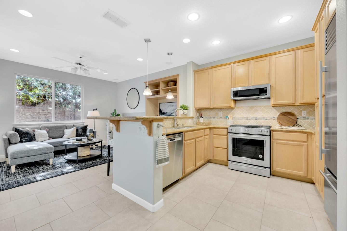 6367 Brando Loop Fair Oaks, CA 95628 - Photo 11 of 59 a kitchen with stainless steel appliances granite countertop a stove sink and cabinets