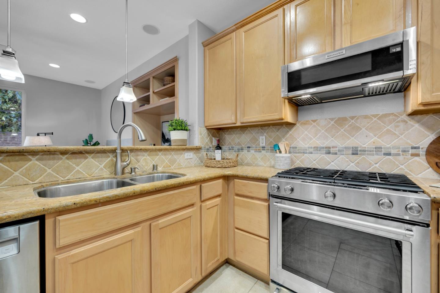 6367 Brando Loop Fair Oaks, CA 95628 - Photo 14 of 59 a kitchen with granite countertop cabinets stainless steel appliances and sink