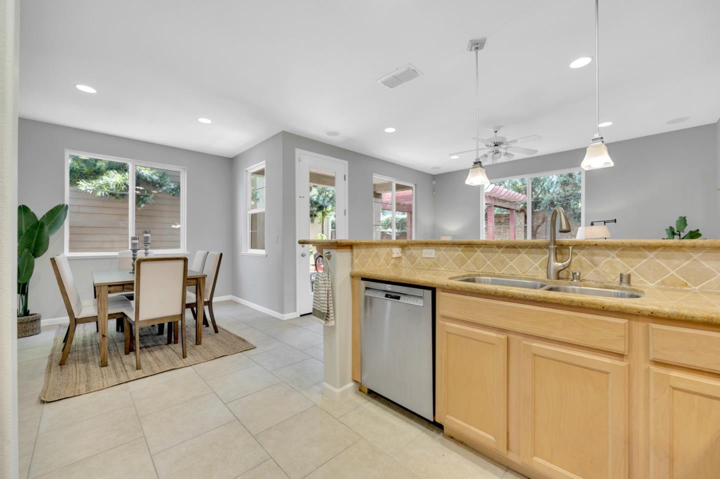 6367 Brando Loop Fair Oaks, CA 95628 - Photo 16 of 59 a kitchen with center island table and chairs