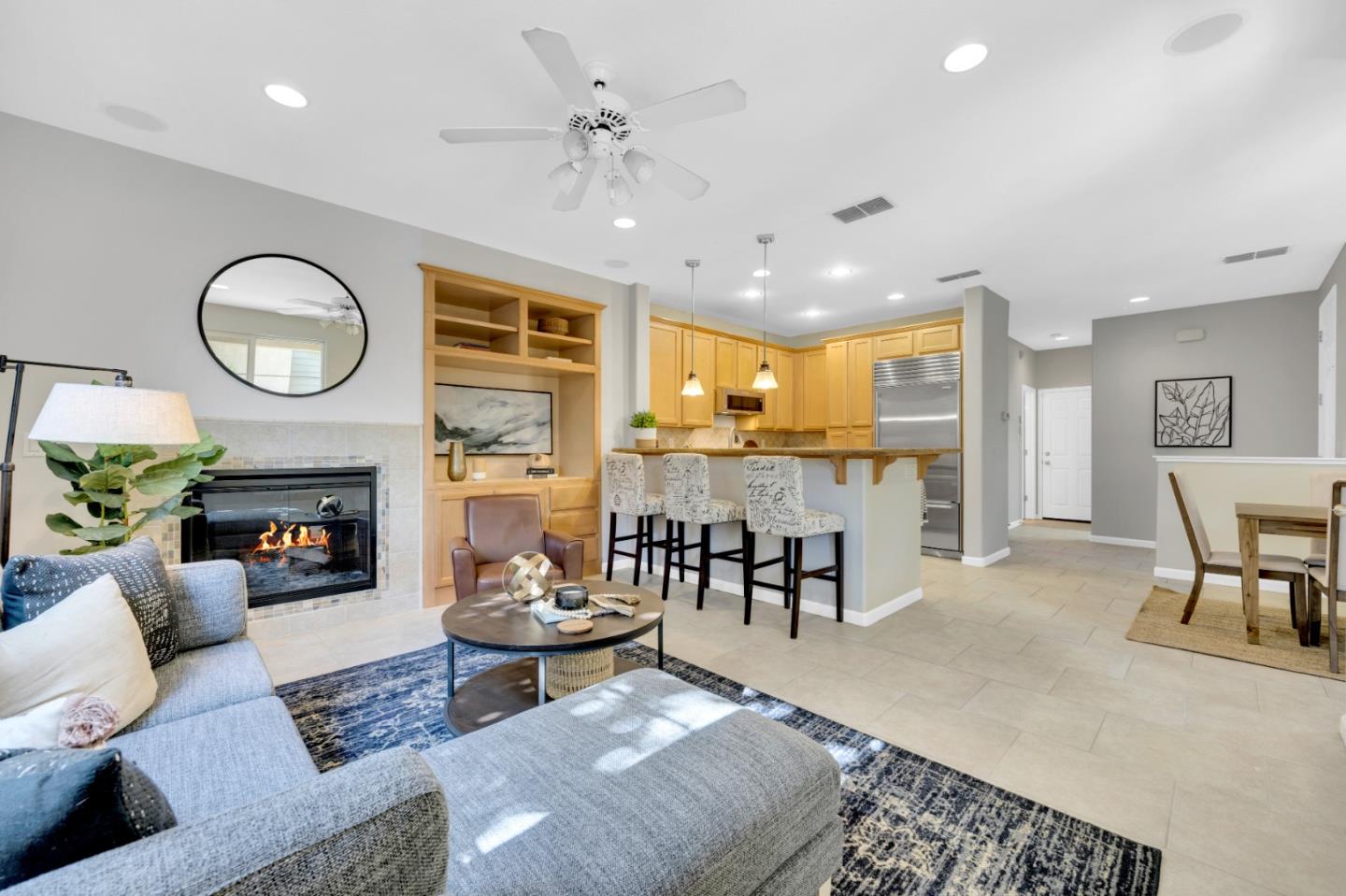 6367 Brando Loop Fair Oaks, CA 95628 - Photo 18 of 59 a living room with fireplace furniture and a large window