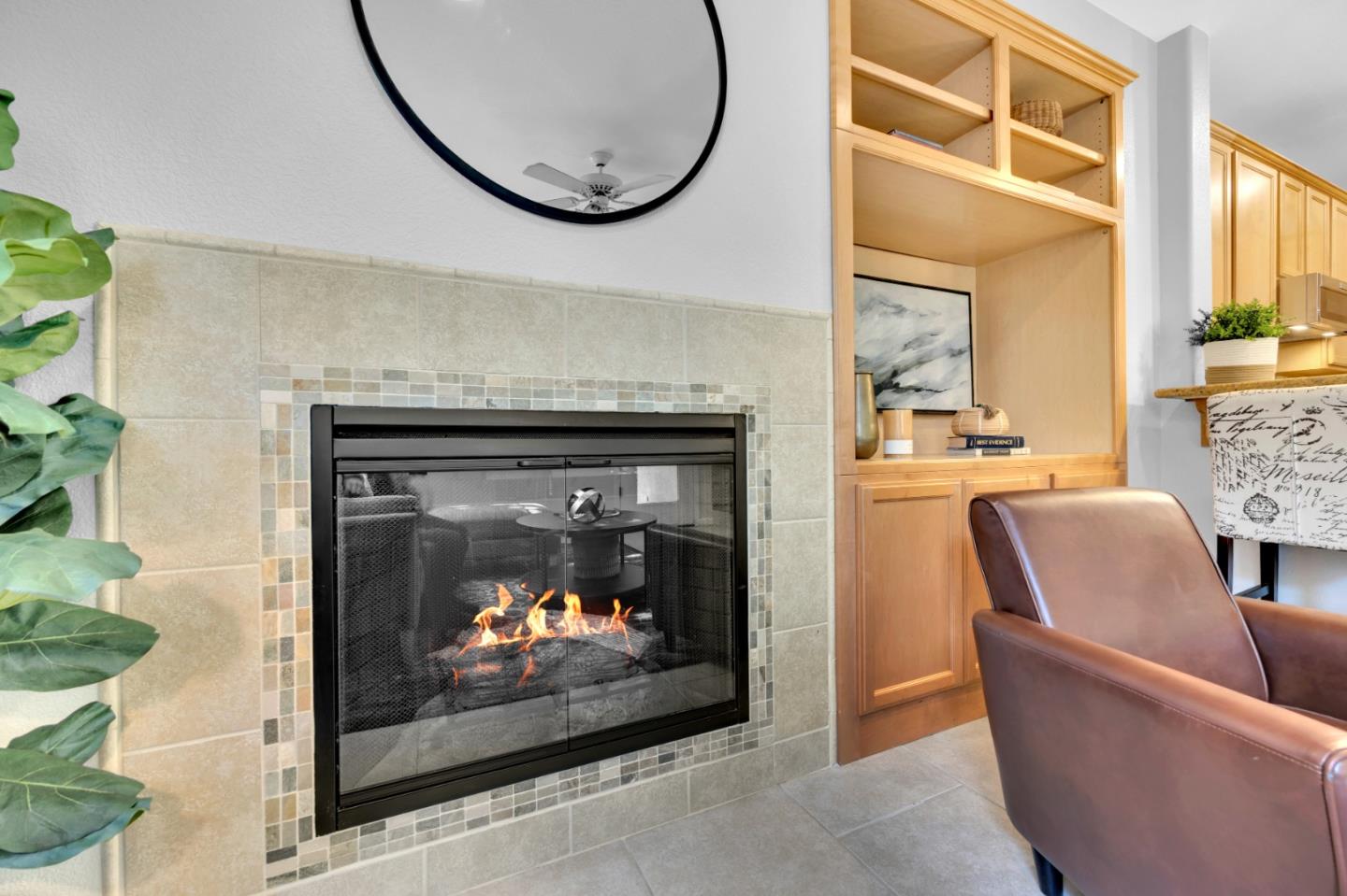 6367 Brando Loop Fair Oaks, CA 95628 - Photo 21 of 59 a living room with furniture a fireplace and a floor to ceiling window