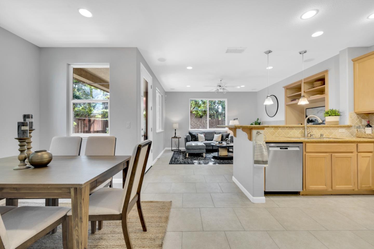 6367 Brando Loop Fair Oaks, CA 95628 - Photo 22 of 59 a open kitchen with stainless steel appliances granite countertop a stove a sink a dining table and chairs